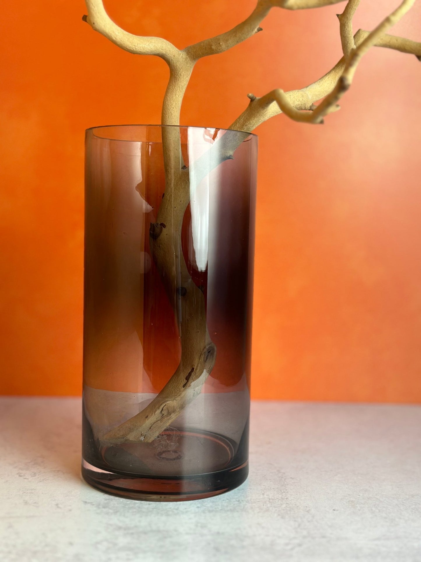 our beautiful smoked glass vase is perfect for Halloween or any time of year this large clear glass vase has an elegant grey smoked finish size is approx. 10" tall by 5" wide
