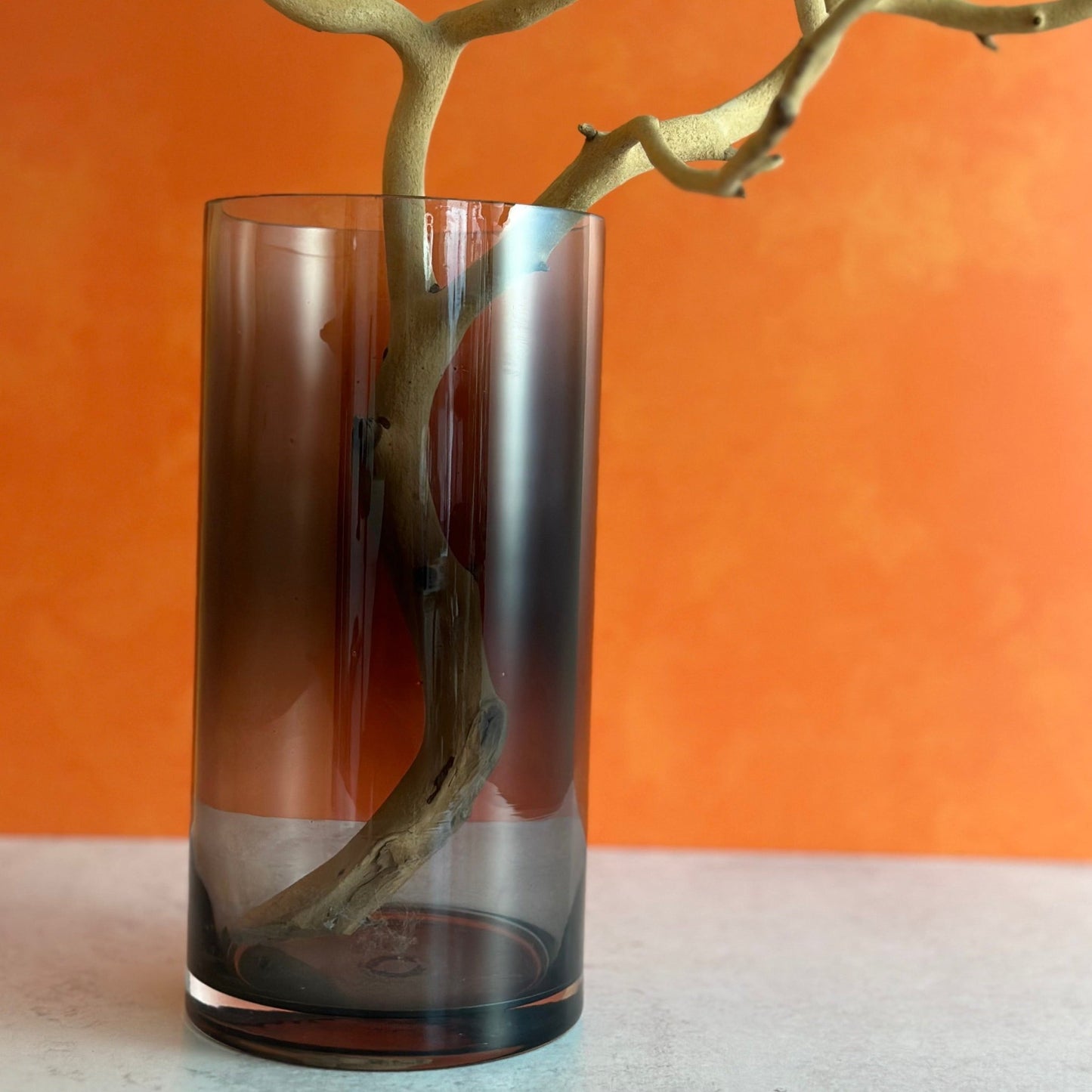 our beautiful smoked glass vase is perfect for Halloween or any time of year this large clear glass vase has an elegant grey smoked finish size is approx. 10" tall by 5" wide