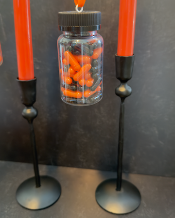 Our Witch's Coven Taper Holders. This set of 3 tall, slender black metal candle holders look like they are hand forged from steel. These spooky holders create a dramatic gothic display that feels right at home in a witch’s cottage, haunted manor, or Halloween tablescape.