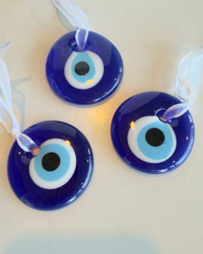 Evil Eye Glass Ornament - Approx. 2" handmade glass tied with a white ribbon.