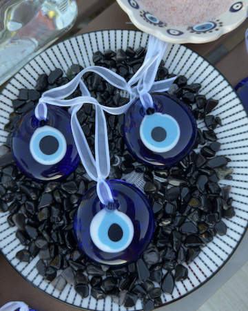 Evil Eye Glass Ornament - Approx. 2" handmade glass tied with a white ribbon.