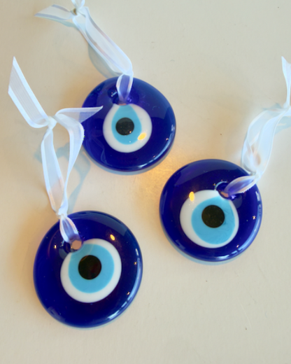 Evil Eye Glass Ornament - Approx. 2" handmade glass tied with a white ribbon.