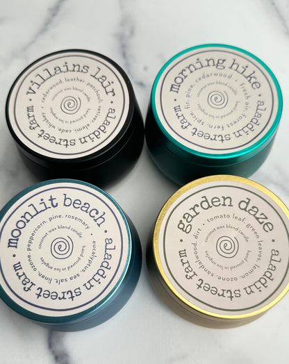 set of four 6oz signature fragrance collection tins - villains lair, morning hike, garden daze & moonlit beach