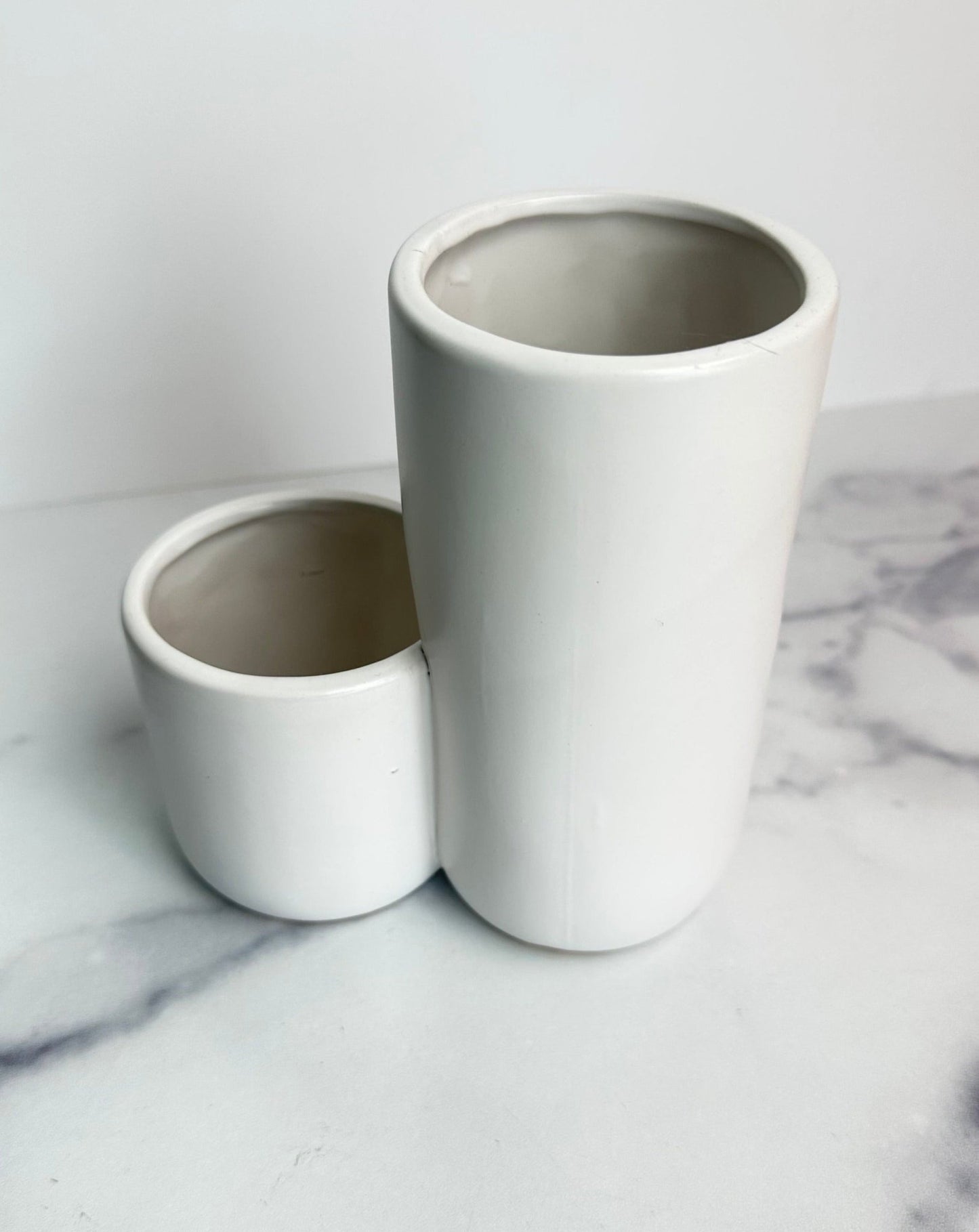 two tiered white ceramic vase