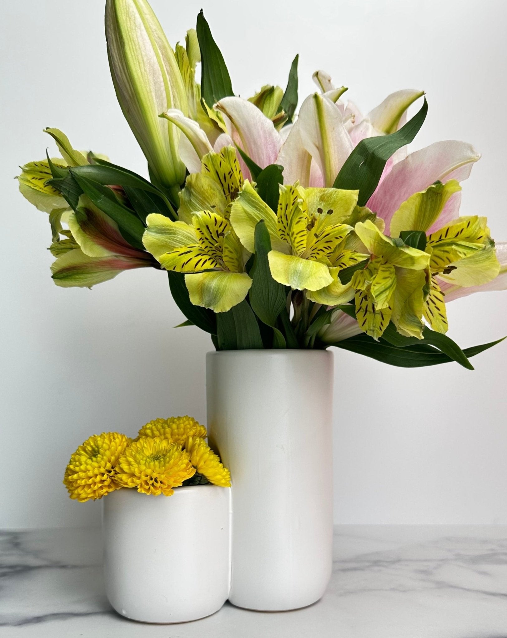 two tiered white ceramic vase