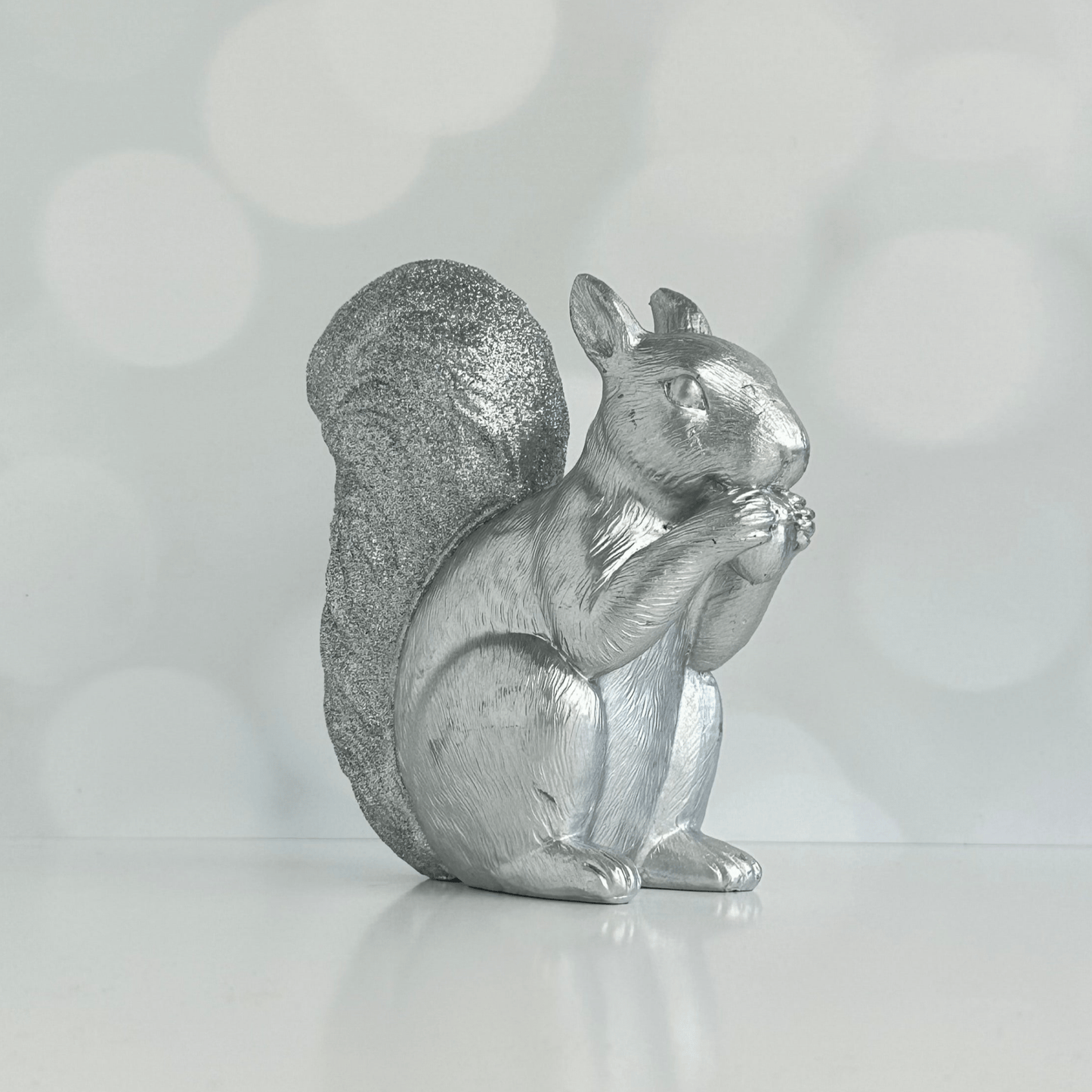 Stan the Silver Squirrel holiday figure with glitter covered tail