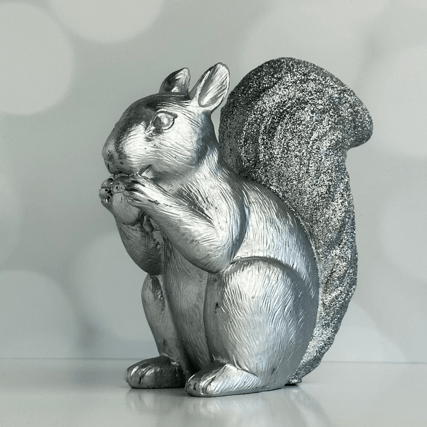 Stan the Silver Squirrel holiday figure with glitter covered tail