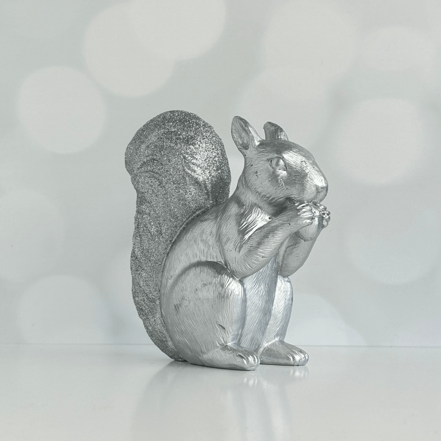 Stan the Silver Squirrel holiday figure with glitter covered tail