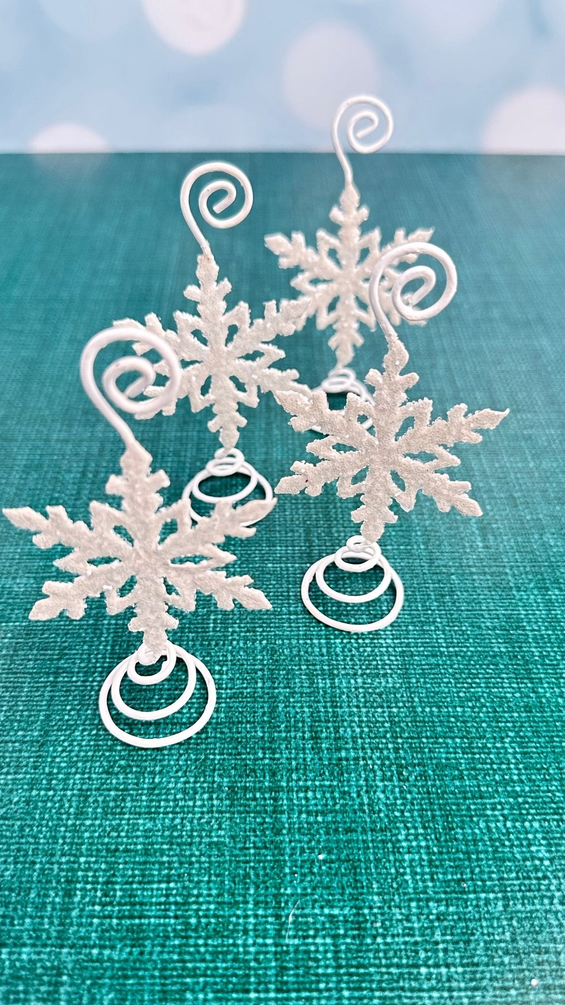 Set of 4 white glittered snowflake place card holders