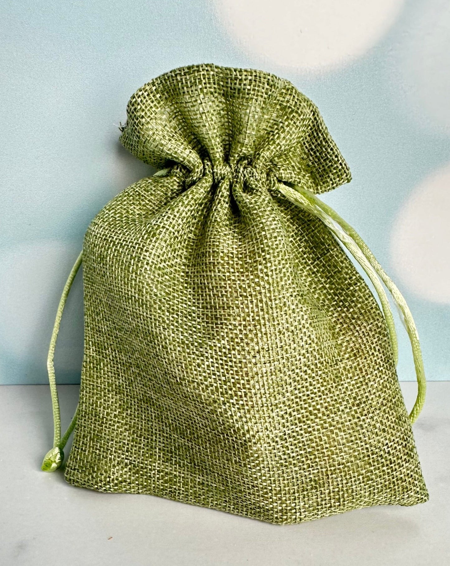 bag o' carrots in green burlap drawstring bag