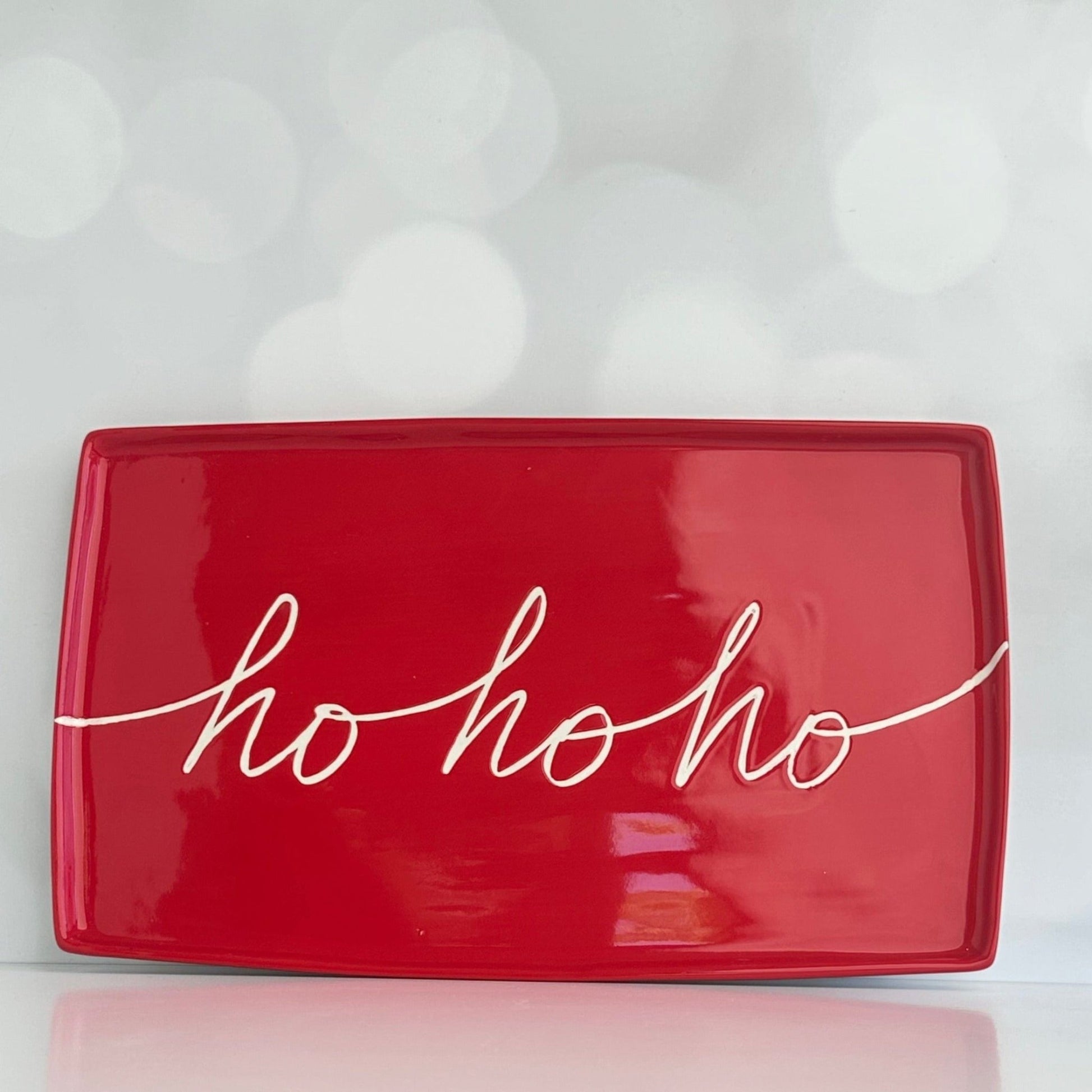 We put the HO in the HOLIDAYS!  Start a Christmas tradition with our large ceramic platter that is perfect for Santa's Cookies  our ceramic platter is approx. 13" x 7.75" x .5"&nbsp;