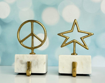 star and peace symbol brass with marble base christmas stocking holders