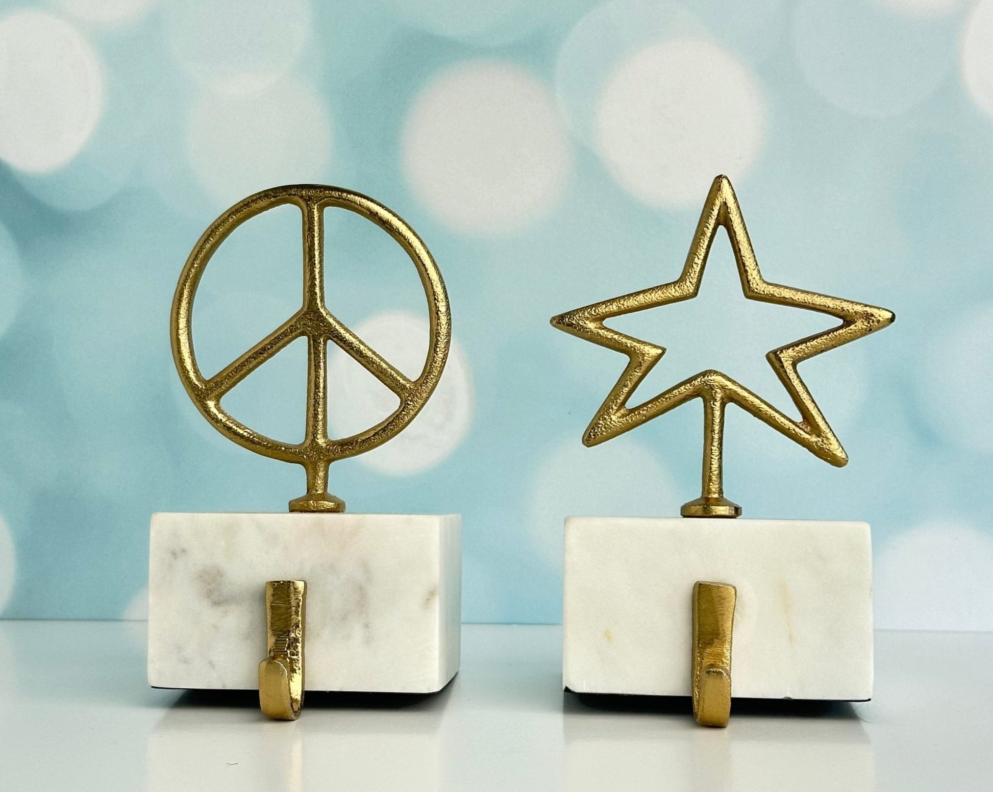 star and peace symbol brass with marble base christmas stocking holders