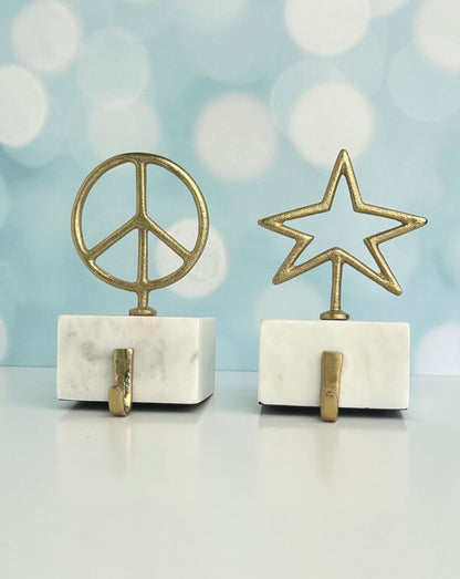 star and peace symbol brass with marble base christmas stocking holders