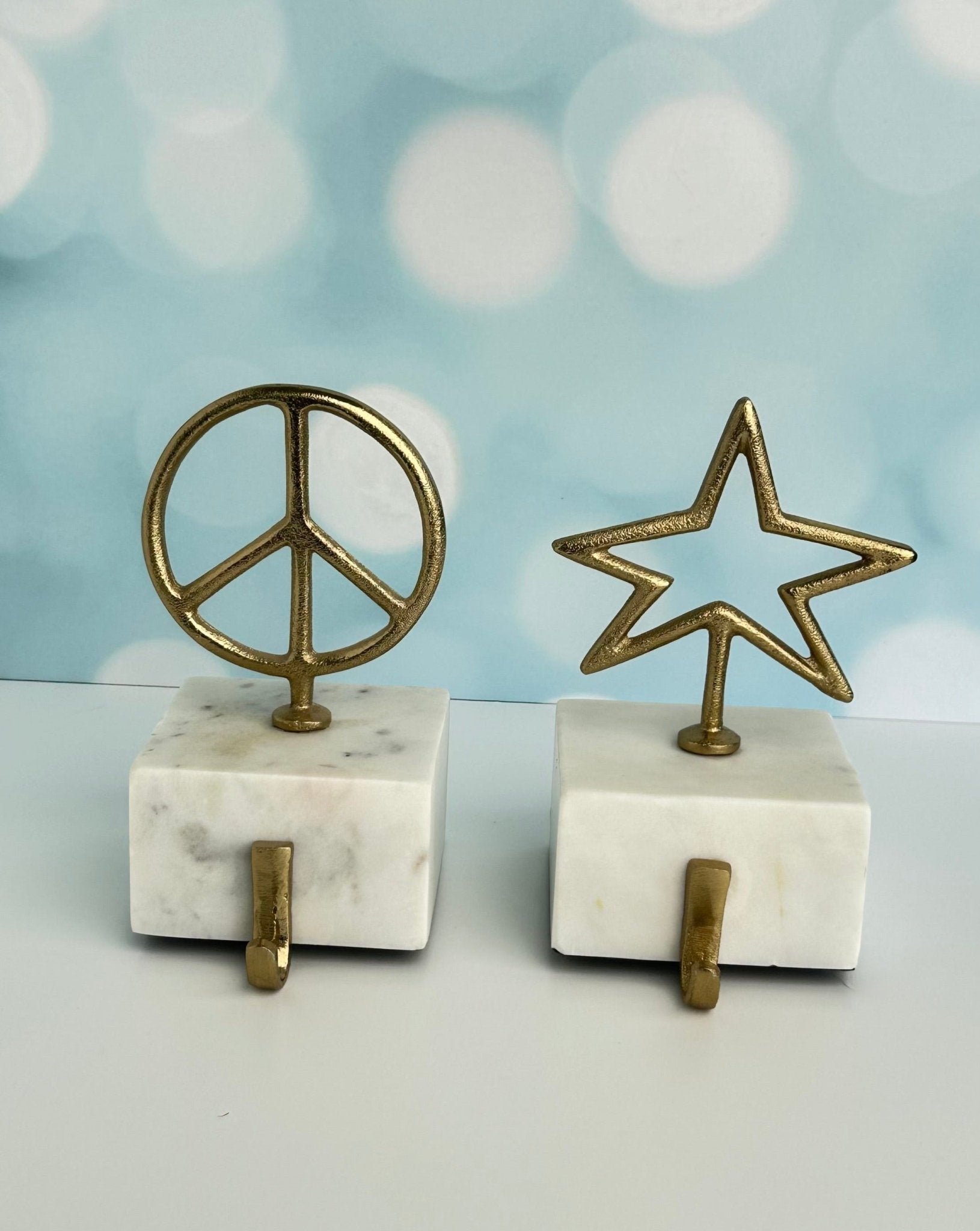 star and peace symbol brass with marble base christmas stocking holders