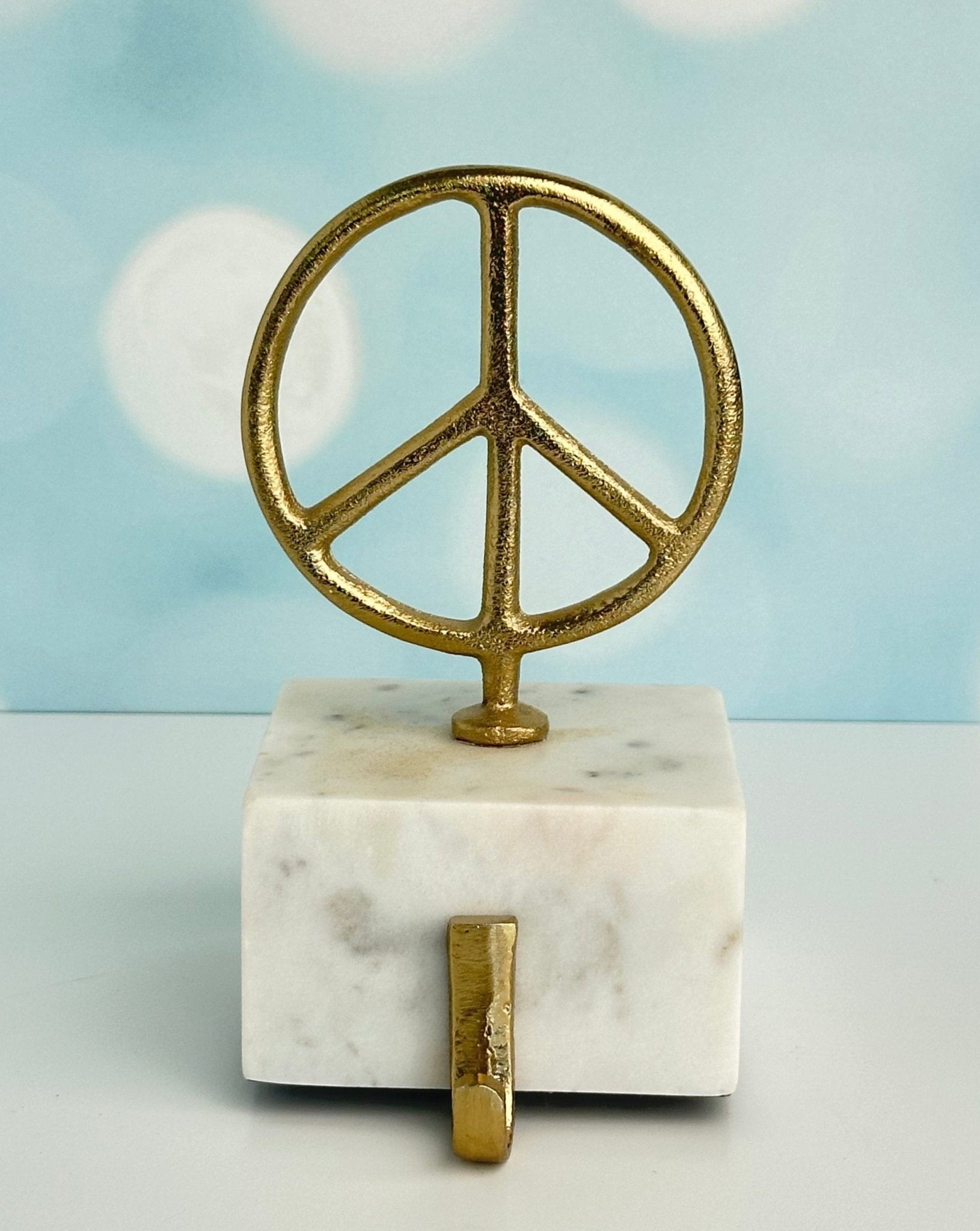 star and peace symbol brass with marble base christmas stocking holders