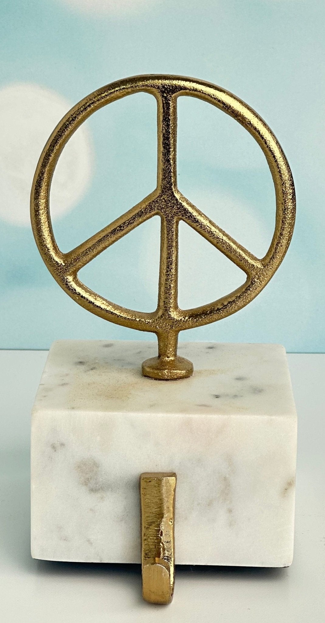 star and peace symbol brass with marble base christmas stocking holders