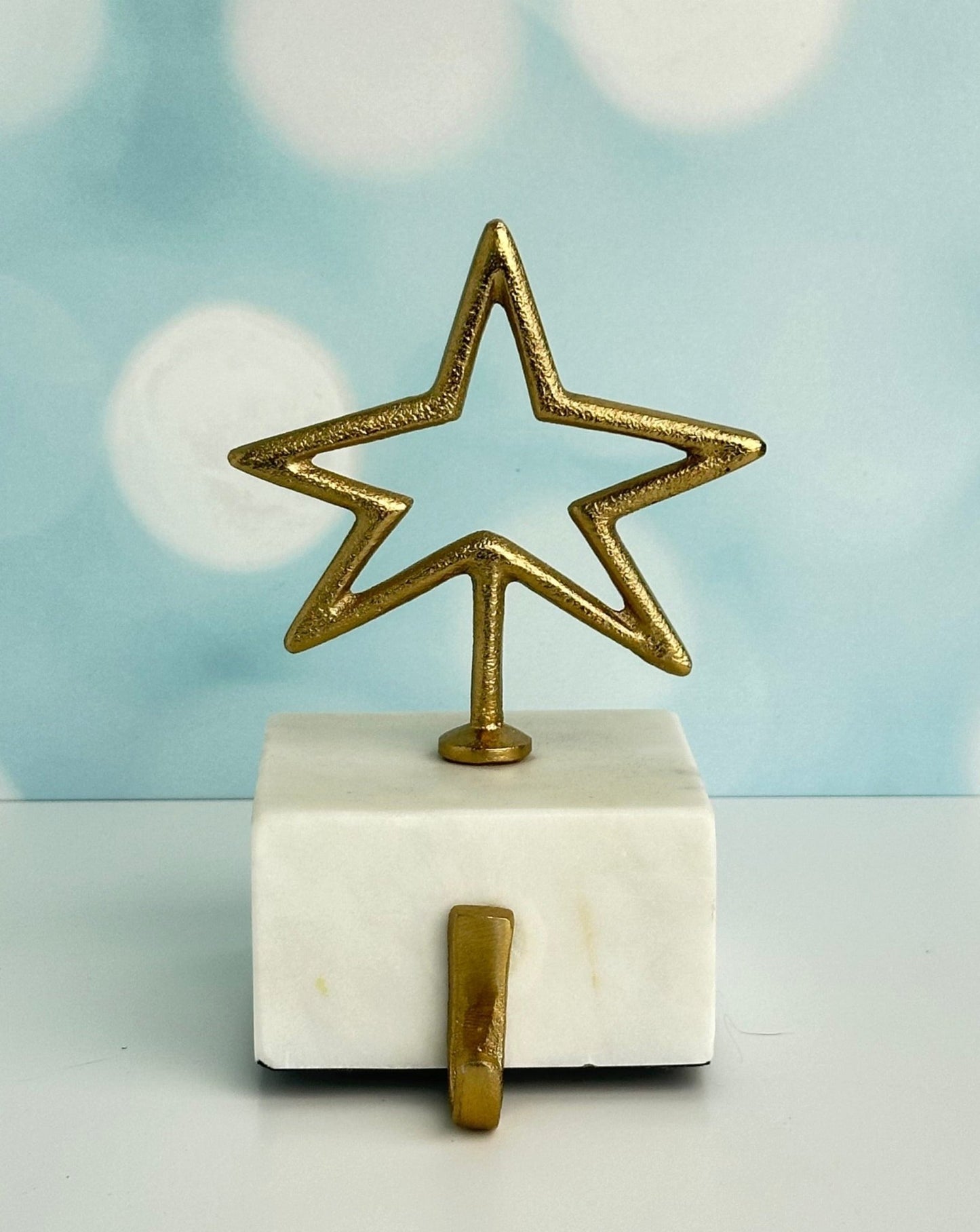 star and peace symbol brass with marble base christmas stocking holders