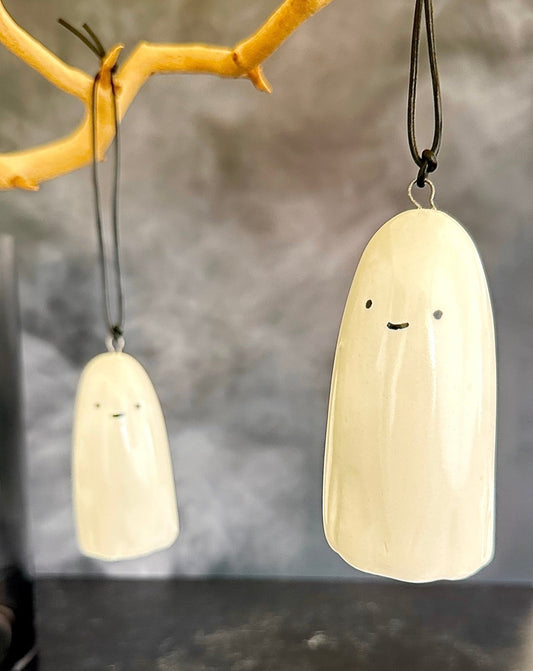 this adorable little ghost can do lots of things. haunt you. hang and delight you. hold a tillandsia air plant for you. or just help put the cute and spooky in your Halloween. ceramic. approx. 1.75" x 3.75" tall. comes with cord for hanging.