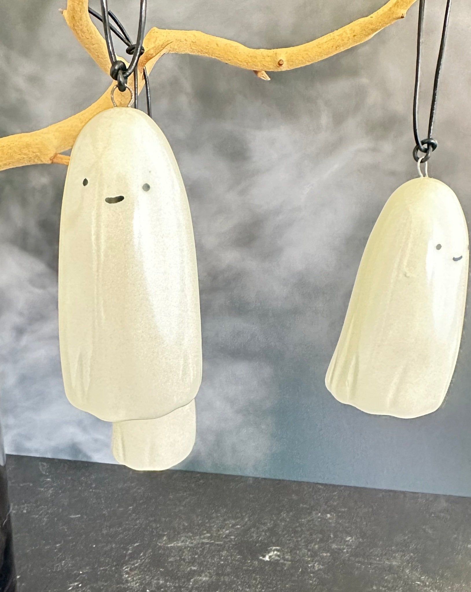 this adorable little ghost can do lots of things. haunt you. hang and delight you. hold a tillandsia air plant for you. or just help put the cute and spooky in your Halloween. ceramic. approx. 1.75" x 3.75" tall. comes with cord for hanging.