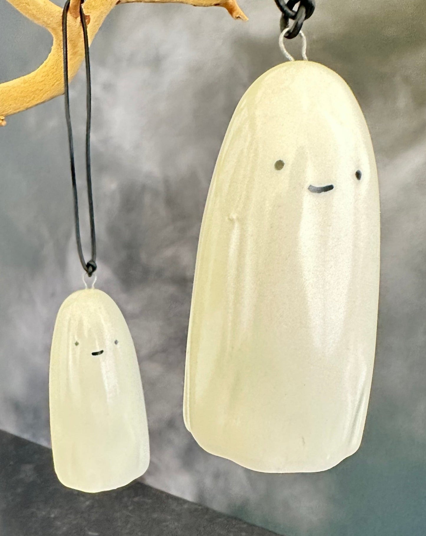 this adorable little ghost can do lots of things. haunt you. hang and delight you. hold a tillandsia air plant for you. or just help put the cute and spooky in your Halloween. ceramic. approx. 1.75" x 3.75" tall. comes with cord for hanging.