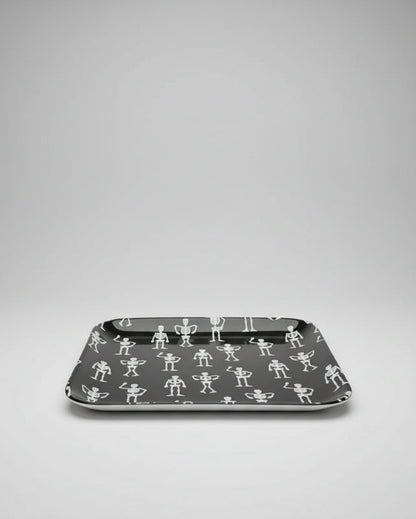 A square ceramic black appetizer tray with rounded corners, featuring a repeating pattern of small white stick-figure skeletons. Approx. 8.25" square.