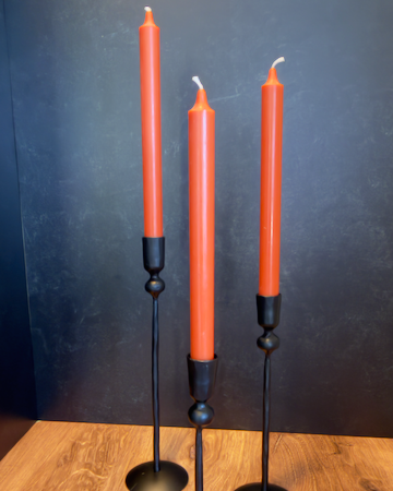 Our Witch's Coven Taper Holders. This set of 3 tall, slender black metal candle holders look like they are hand forged from steel. These spooky holders create a dramatic gothic display that feels right at home in a witch’s cottage, haunted manor, or Halloween tablescape.