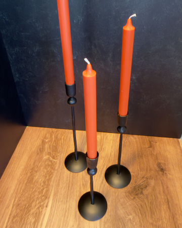 Our Witch's Coven Taper Holders. This set of 3 tall, slender black metal candle holders look like they are hand forged from steel. These spooky holders create a dramatic gothic display that feels right at home in a witch’s cottage, haunted manor, or Halloween tablescape.