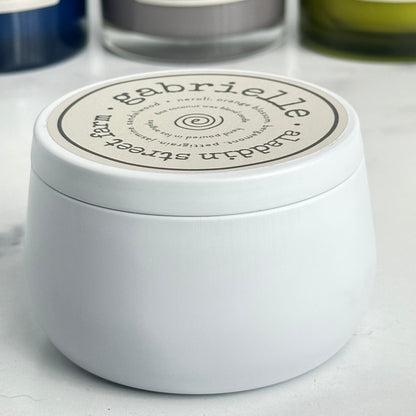 a side view of the gabrielle candle tin