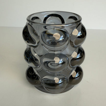 these modern glass votive holders have an iridescent shine that really makes them pop wherever they are placed.

this set of 2 will hold either a votive or tealight candle

approx. 3.5" high x 3" wide